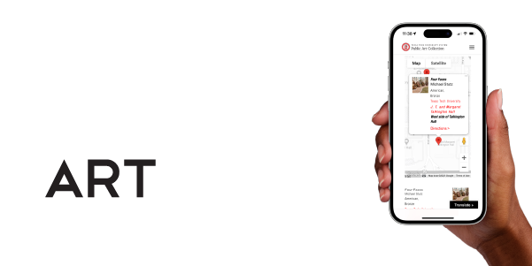 Hand holding phone with mobile version of ArTTrek Map displayed.